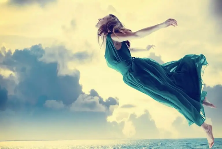 Woman flying in lucid dream feeling free