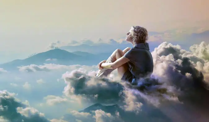 Woman dreaming on a cloud