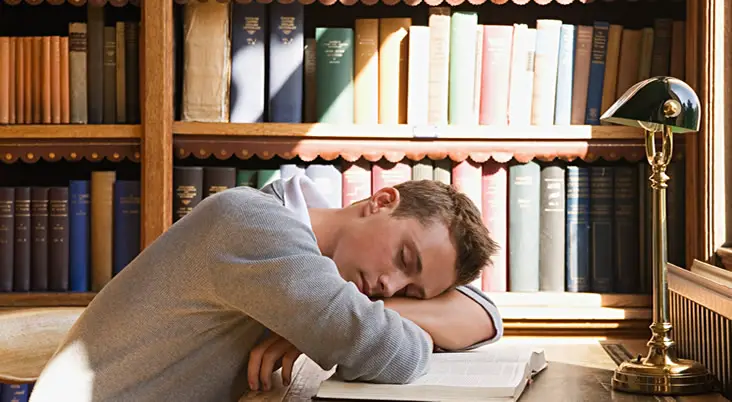 Student sleeping in library