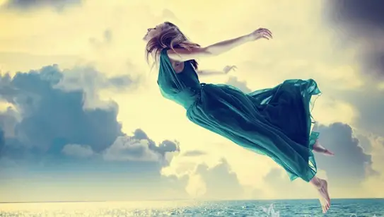 Woman flying in lucid dream
