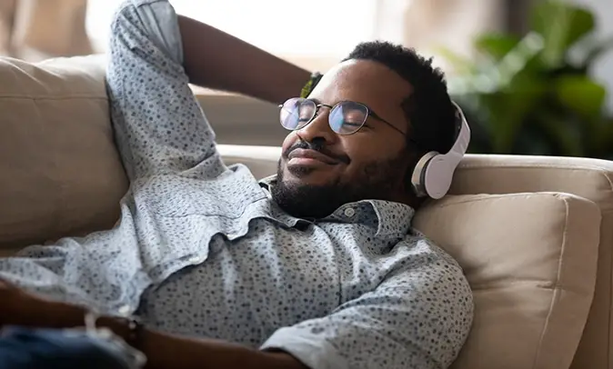 Man having lucid dream while listening to music