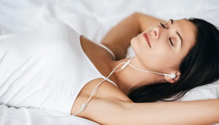 Woman listening to lucid dreaming music