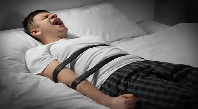 Man experiencing sleep paralysis